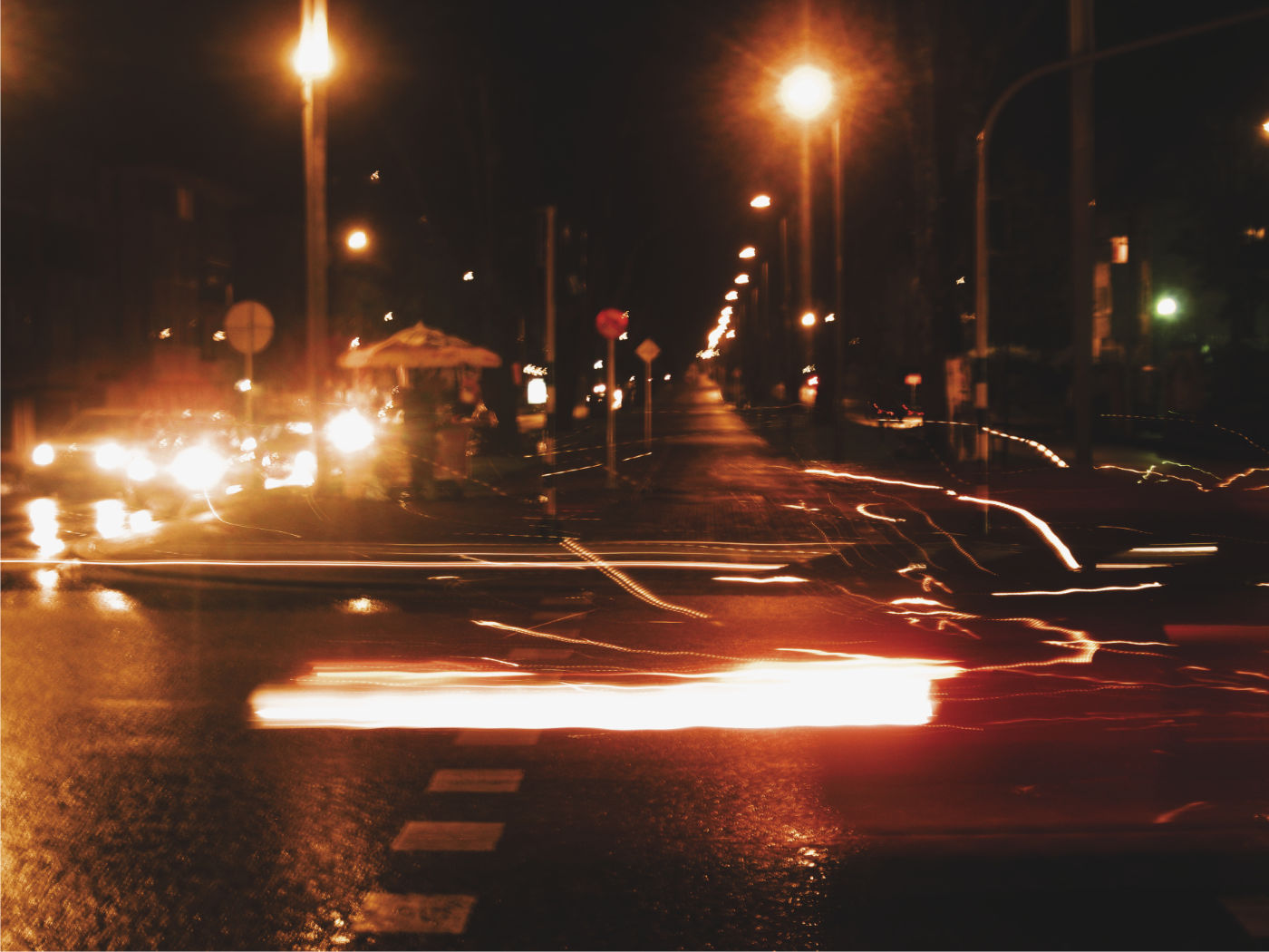 Cars lights flying on an intersection